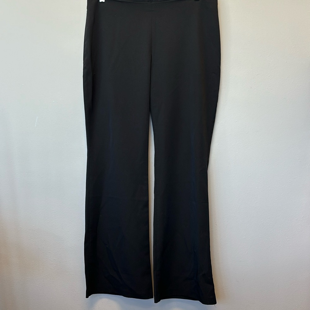 Woman’s black dress slacks. Flair legs sipper in back of pants. Size 2XL.
